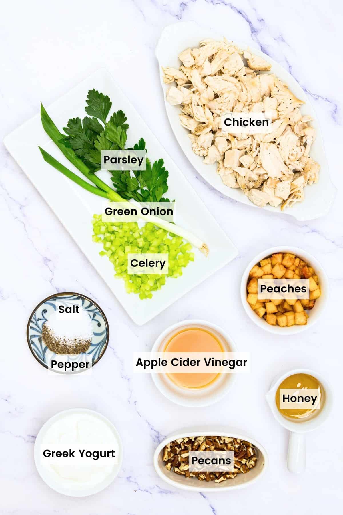 Ingredients for pecan chicken salad are portioned out and text-labeled.