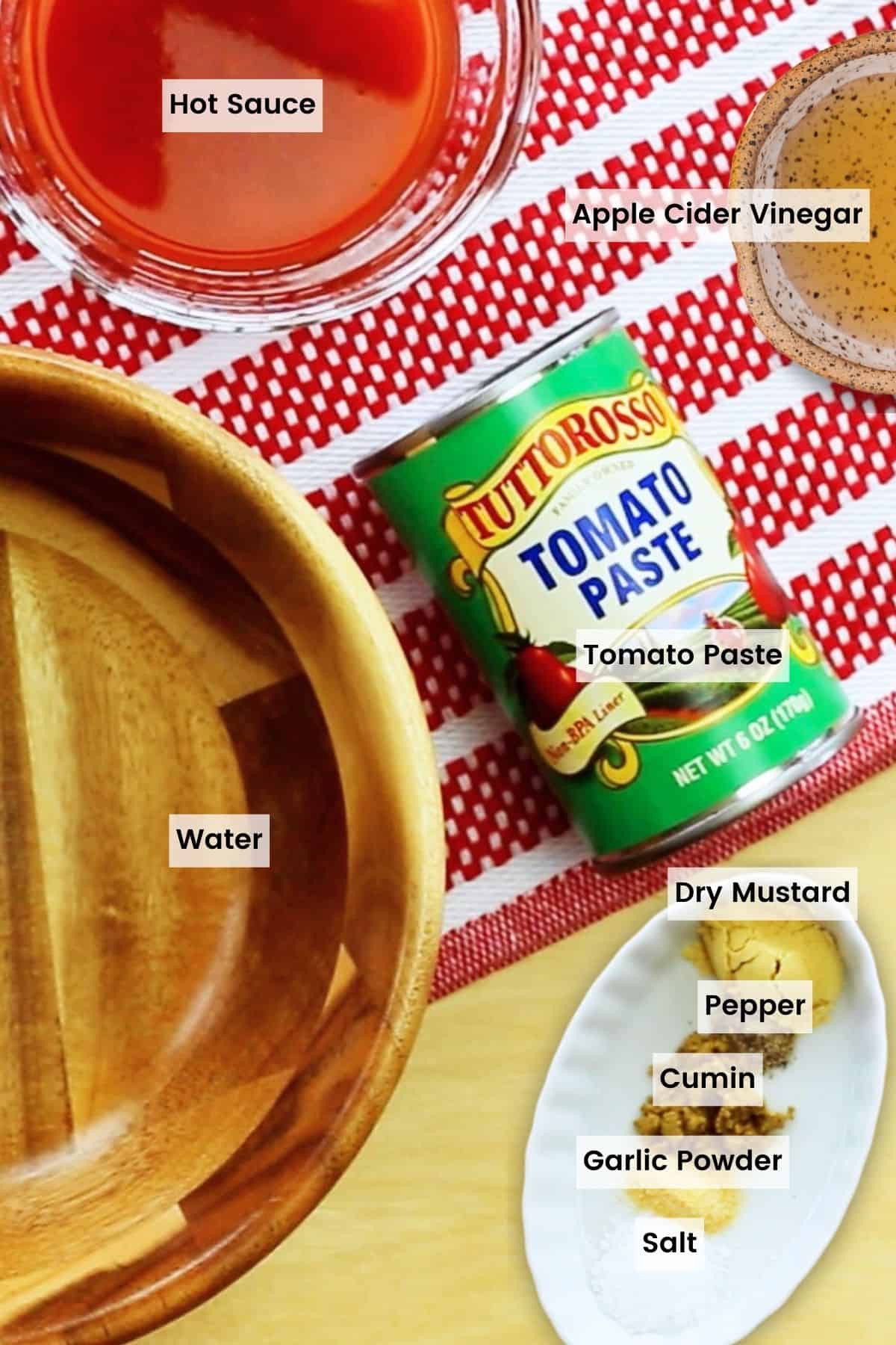 This spicy ketchup recipe makes the best homemade ketchup in just 5 minutes with a hot sauce for a kick of heat. Great on burgers! Ingredients for spicy ketchup are text-labeled.