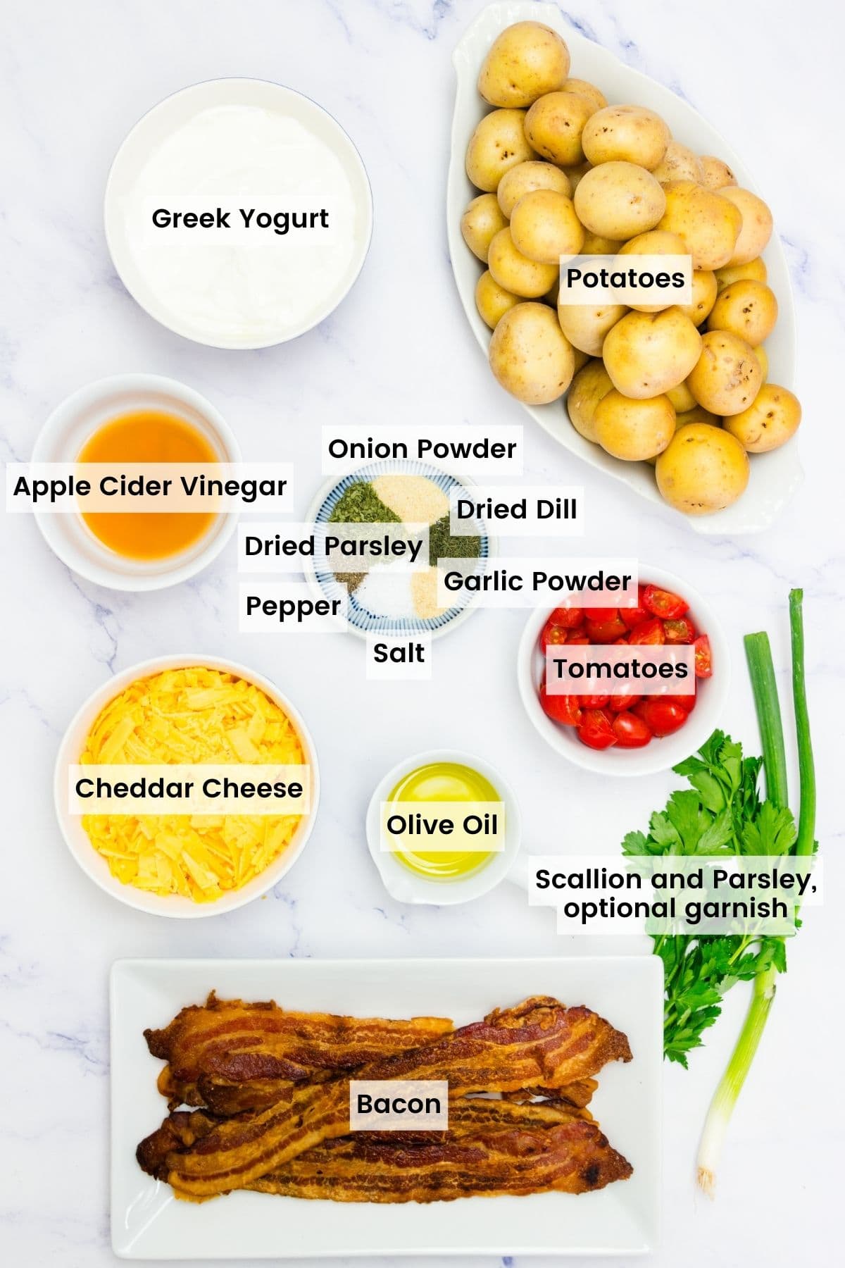The ingredients for ranch potato salad are labeled and portioned out.