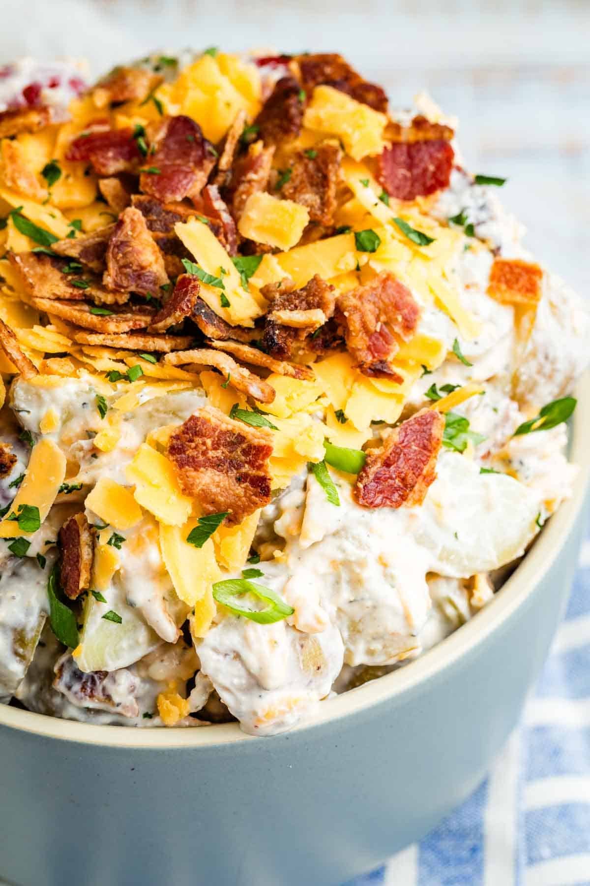 Crisp bacon tops a bowl of ranch potato salad.