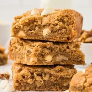 Three gluten free blondies stacked on top of each other.