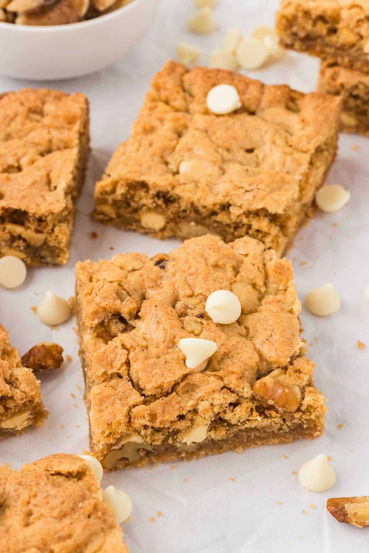 A few gluten free blondies topped with white chocolate chips.