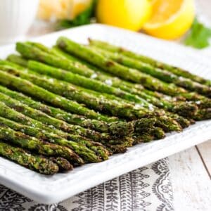 Perfectly grilled asparagus on a plate.