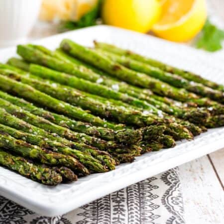 Perfectly grilled asparagus on a plate.