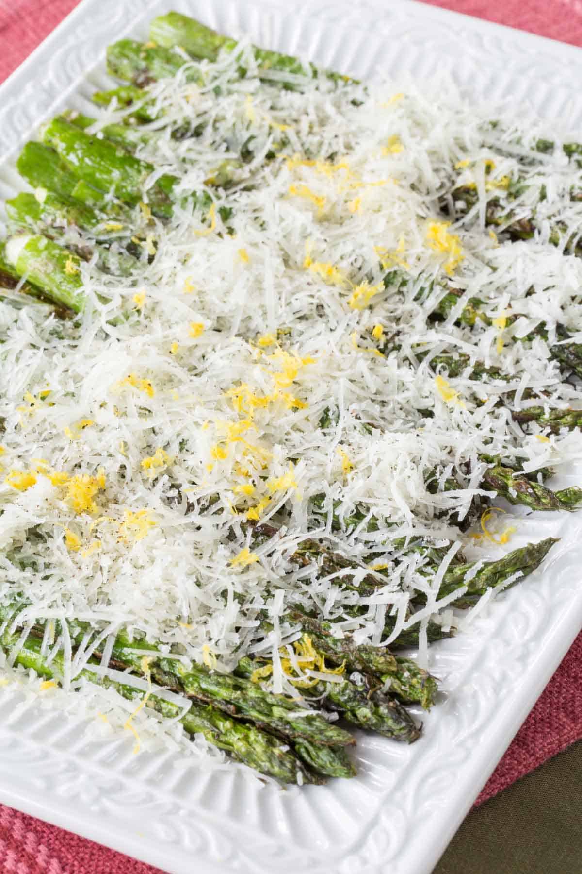A plate of grilled lemon parmesan asparagus.