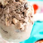 Scoops of no-churn brownie batter ice cream are served in a glass dish.