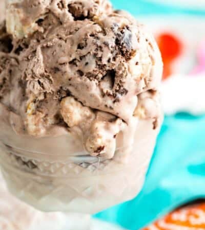 Scoops of no-churn brownie batter ice cream are served in a glass dish.