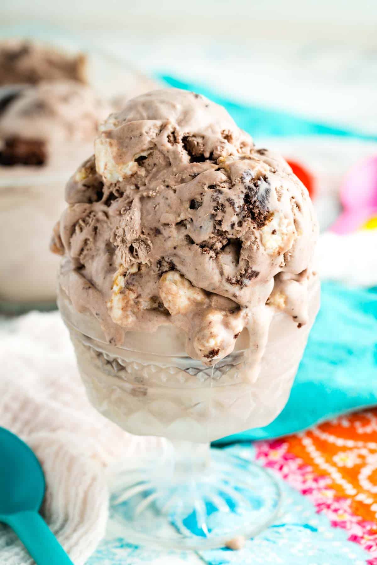 Brownie bits peek out of a scoop of no-churn brownie batter ice cream.