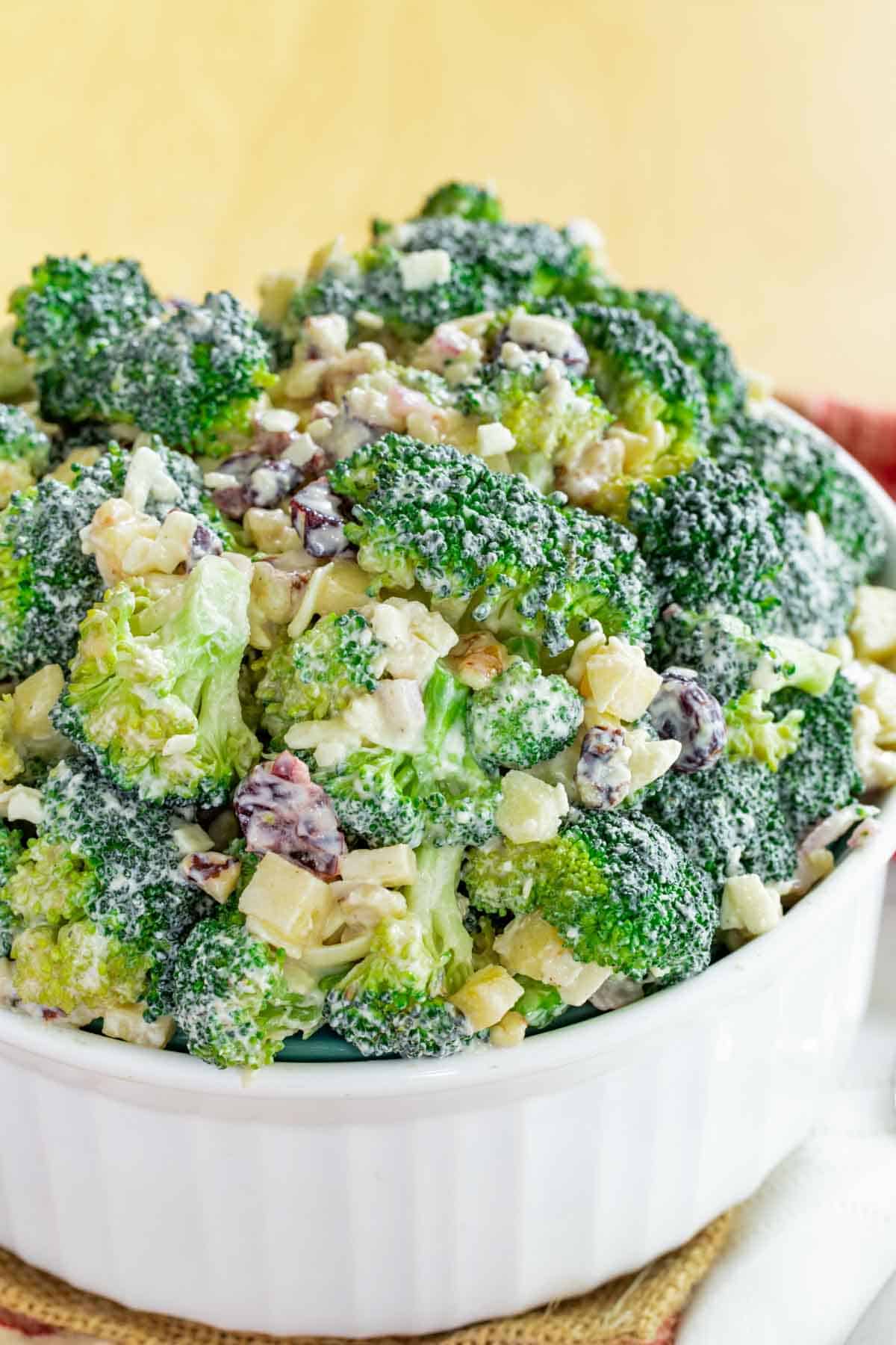 Overhead image of broccoli apple salad in a serving bowl.