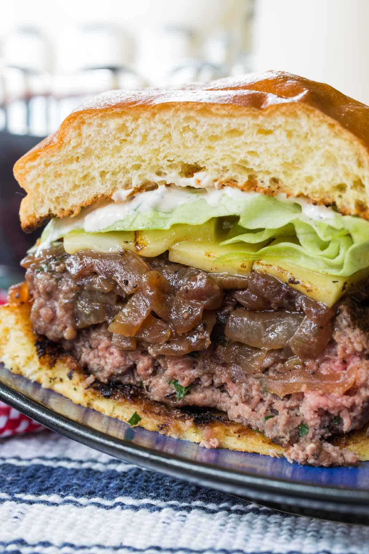 A French onion burger cut in half.
