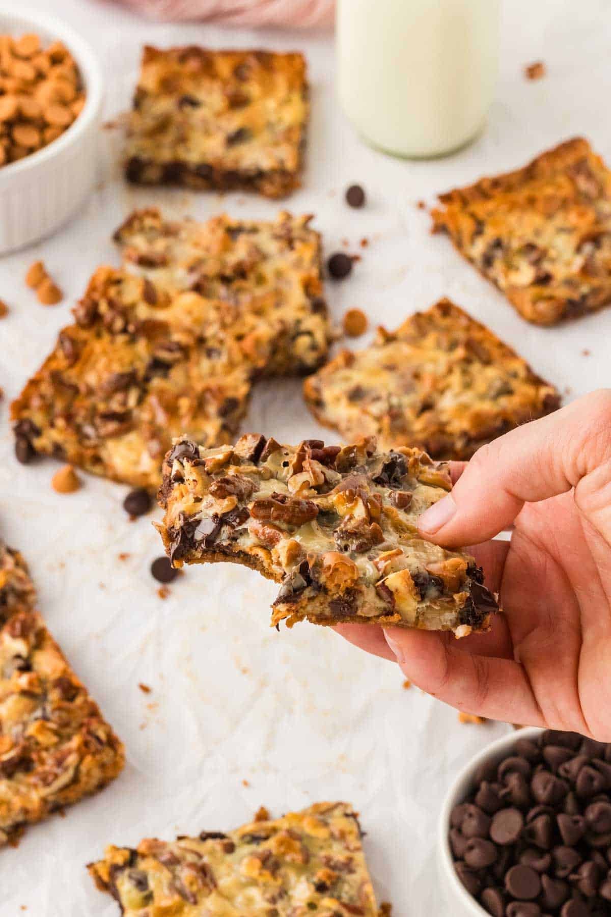 A hand holding a 7 layer bar up to the camera.