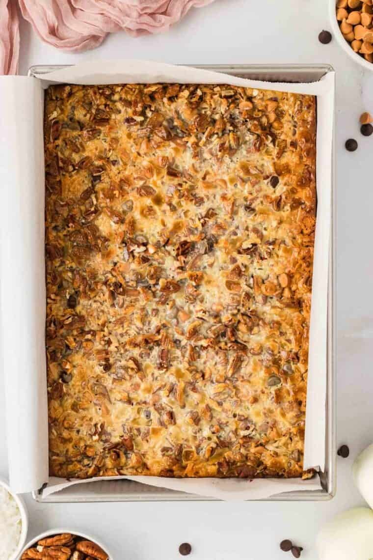 Overhead image of 7 layer bars in a baking pan.