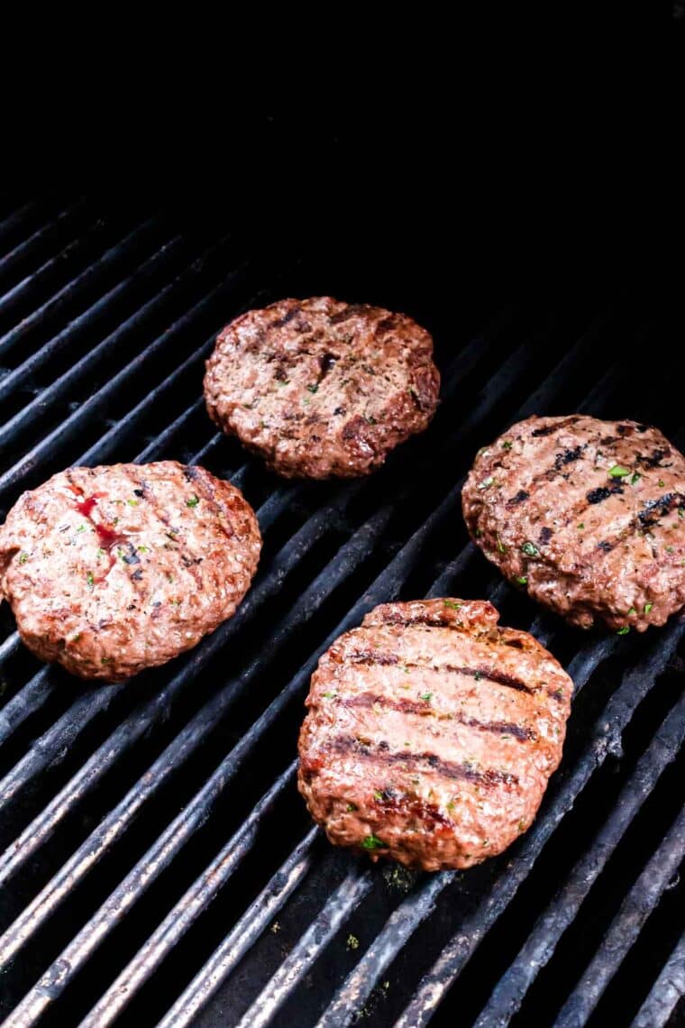 Grilling french onion burgers.