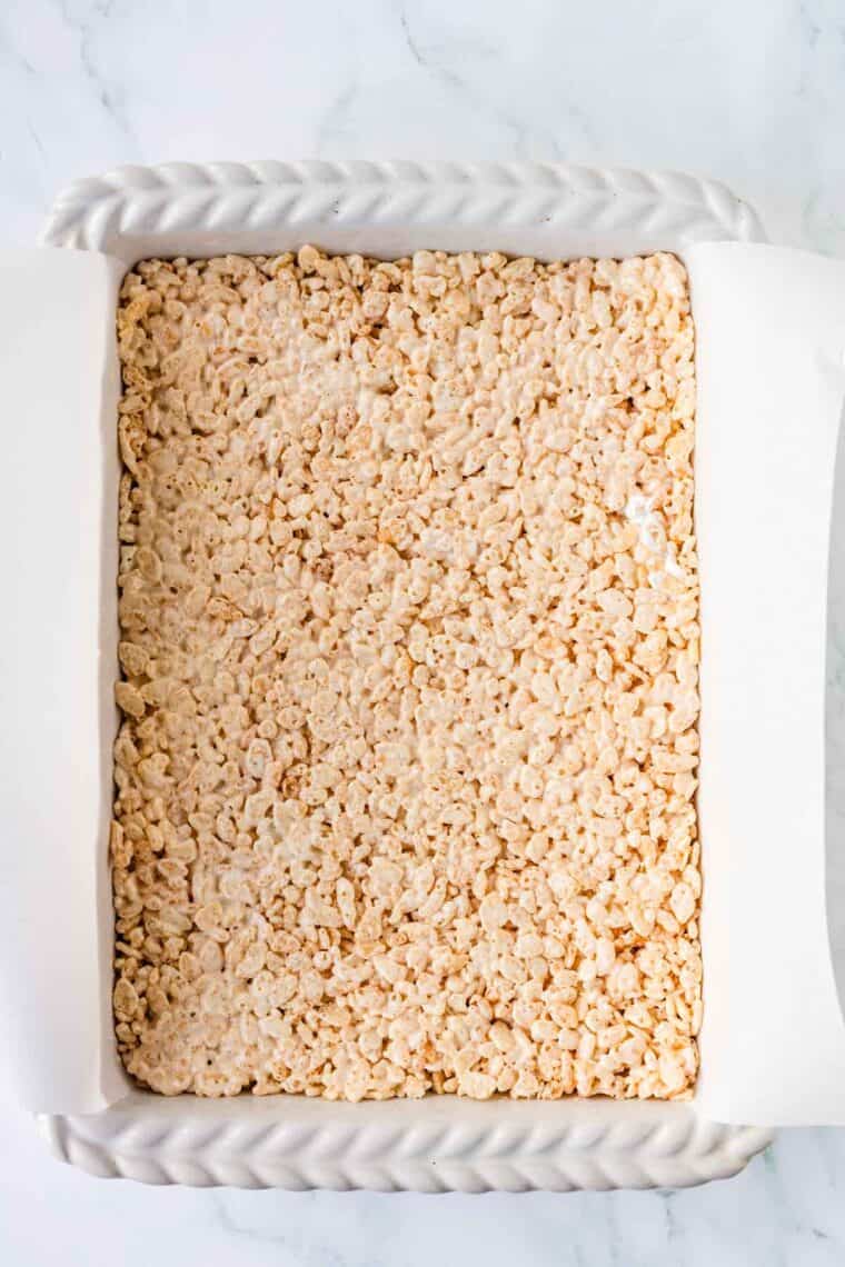 Rice krispie treats cooling in the pan.