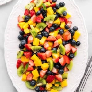 Featured image for mango berry fruit salad recipe.