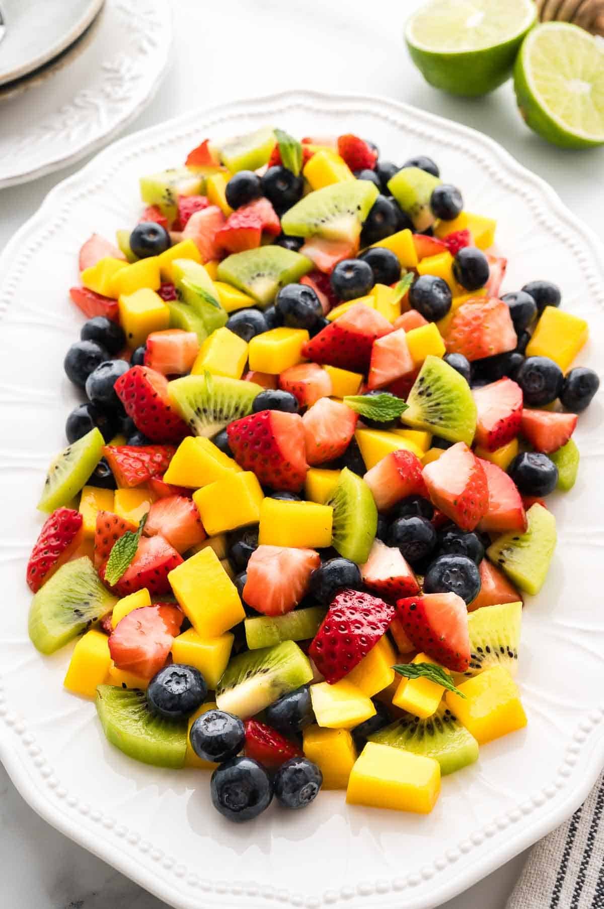 Mango berry fruit salad on a serving platter.