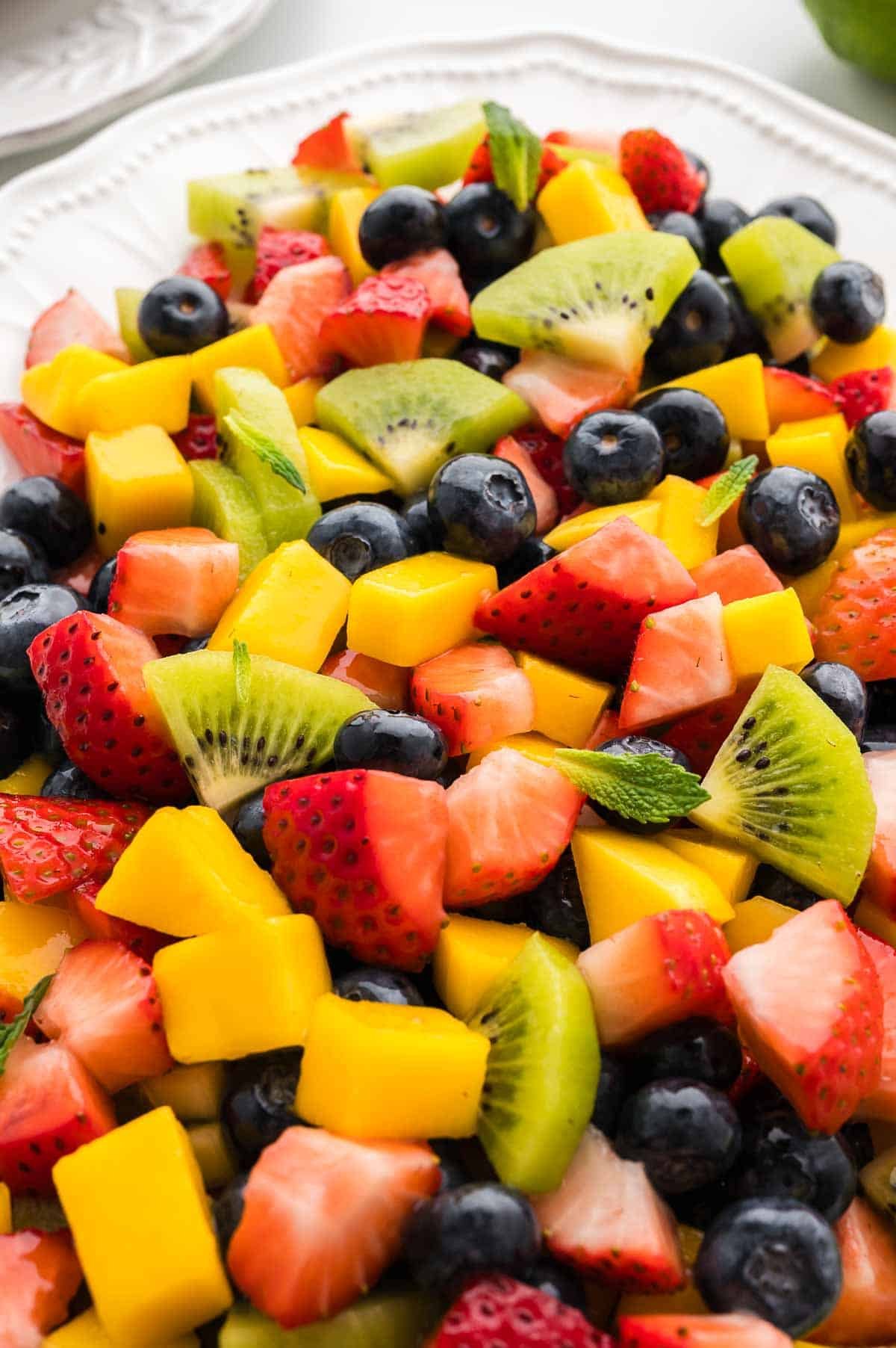 Close-up image of mango berry fruit salad.