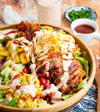 The best BBQ chicken and pineapple salad in a wooden salad bowl.
