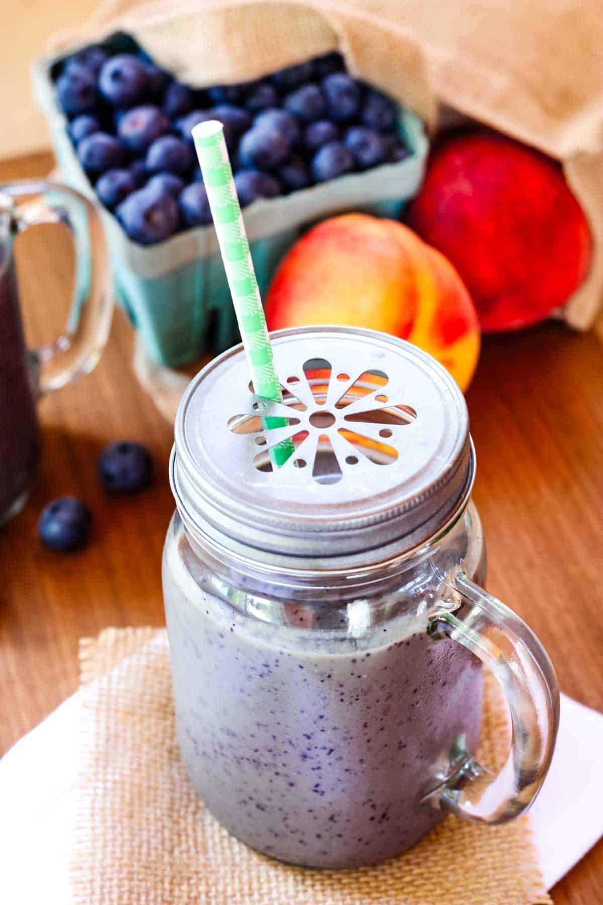 Blueberry peach smoothie in a jar.