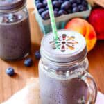 Blueberry peach smoothie in a jar.