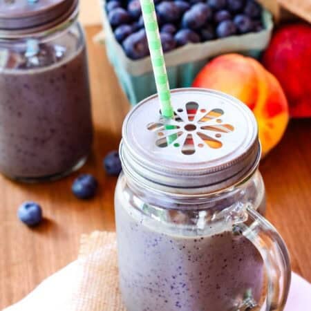 Blueberry peach smoothie in a jar.
