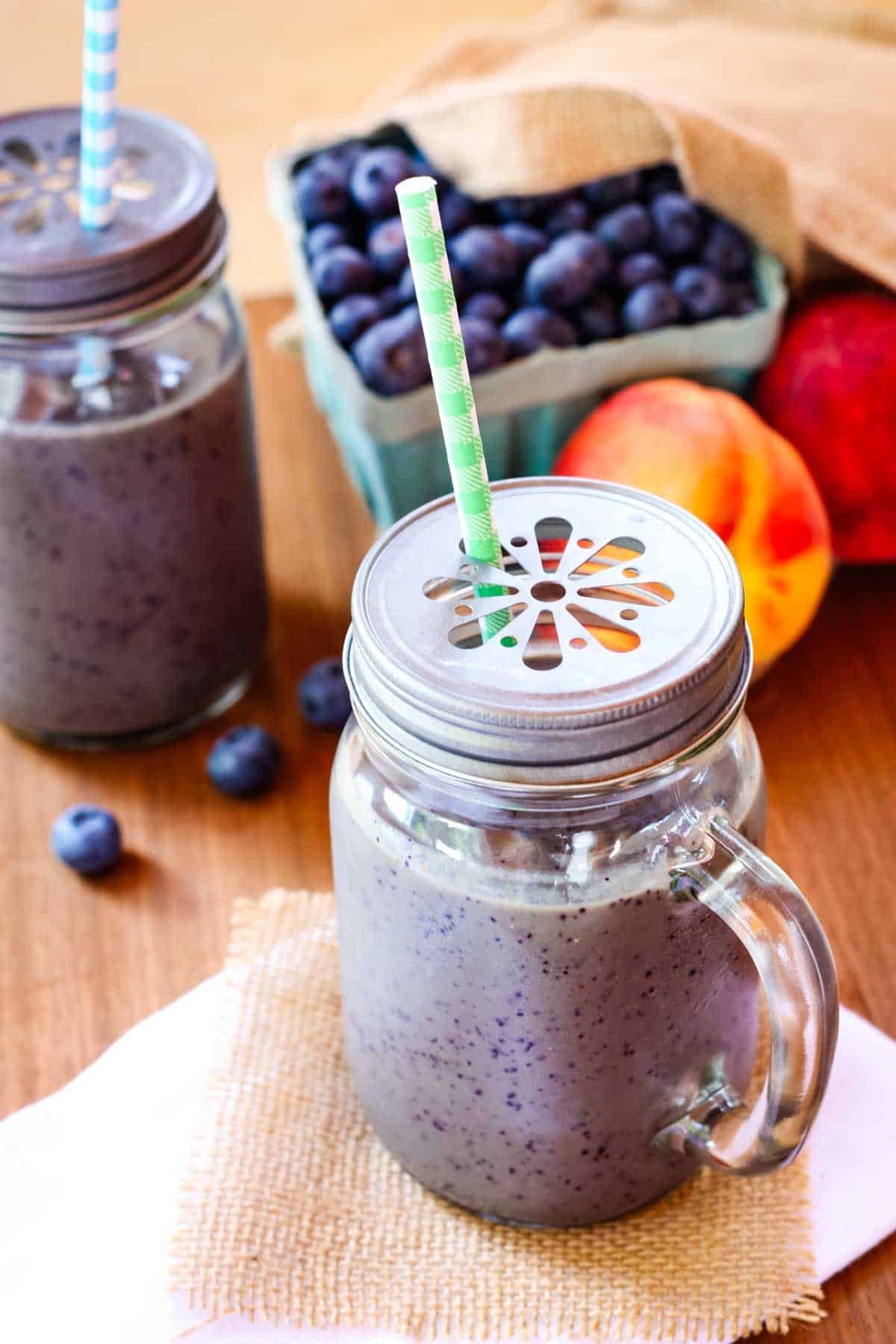 Blueberry peach smoothie in a jar.