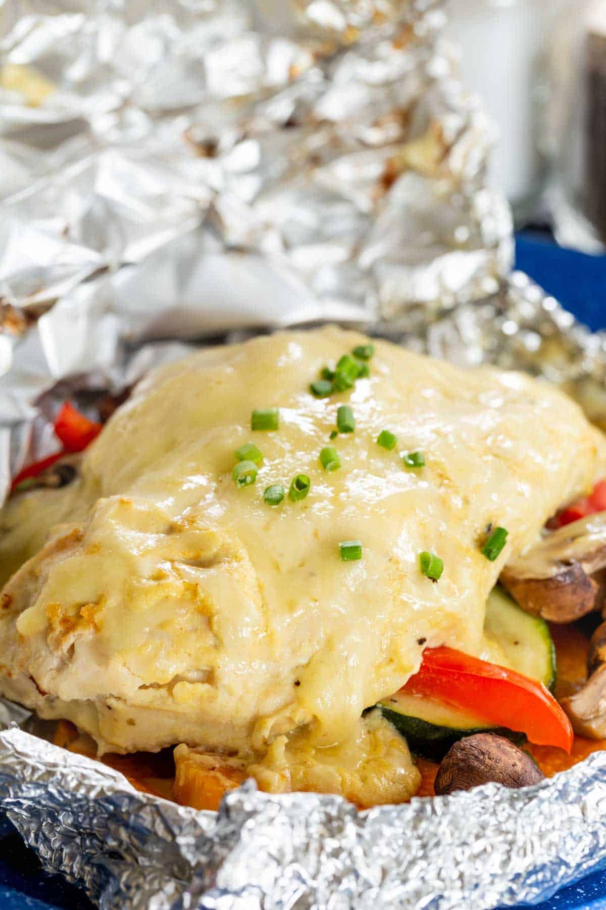 A chicken and veggie foil packet meal.