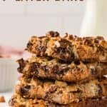 A stack of chewy bars with a graham cracker crust with text overlay that says "Gluten Free 7-Layer Bars".
