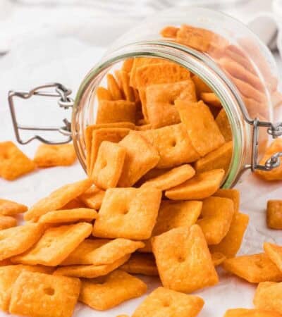 Cheddar crackers pouring out of a jar.