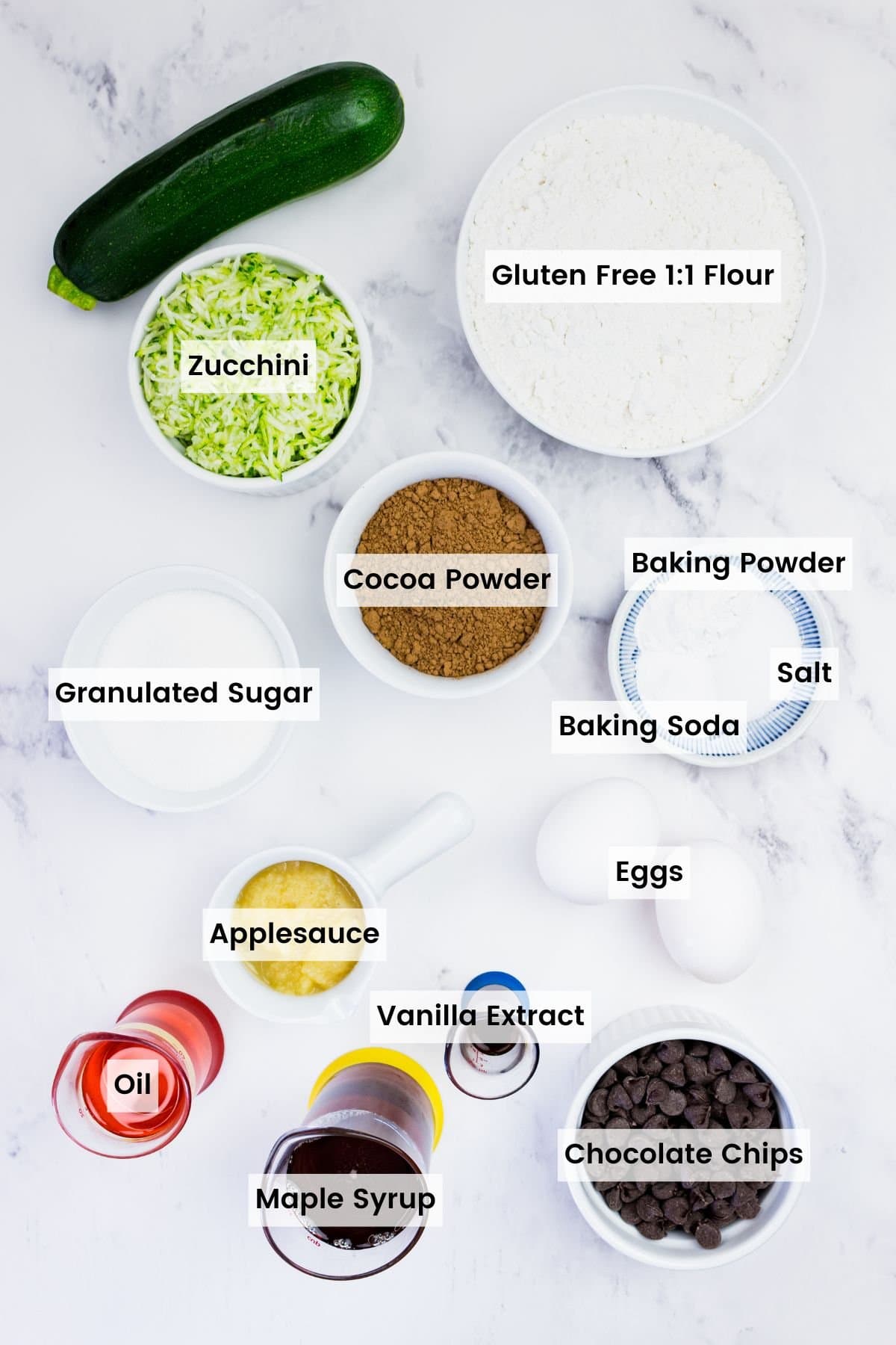 These gluten-free chocolate zucchini muffins are packed with melty chocolate chips and incredibly moist and tender, thanks to the zucchini. Labeled ingredients for gluten free chocolate zucchini muffins.