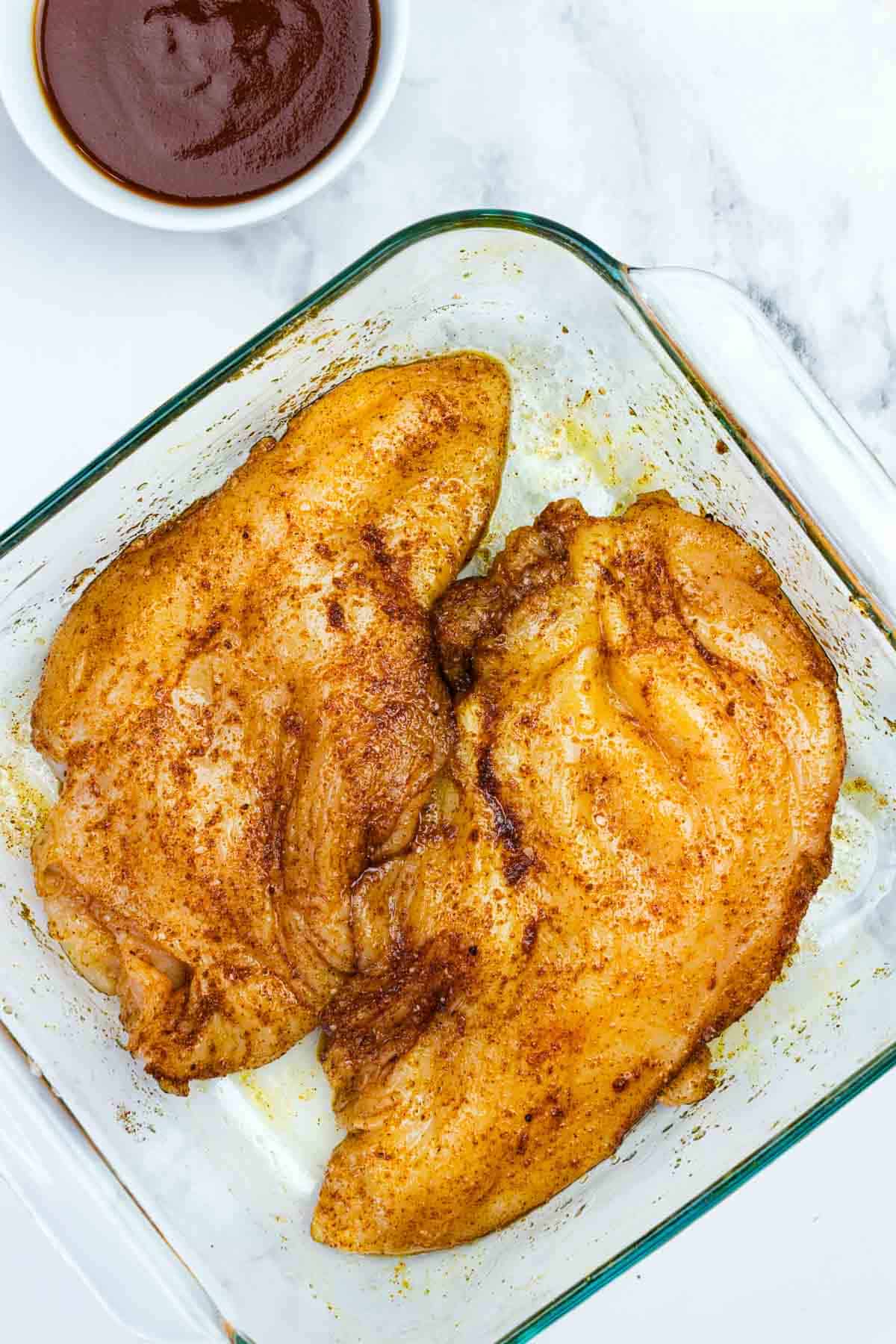 Chicken rubbed with spices and oil.