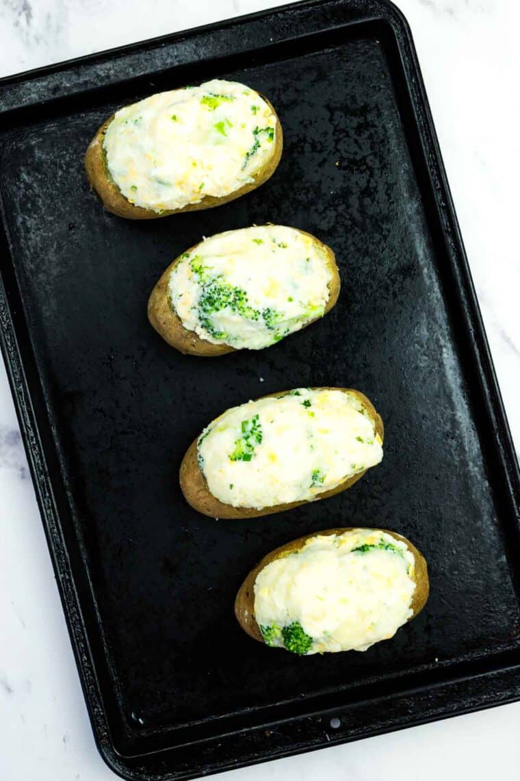 Baked potato shells stuffed with broccoli cheese mashed potatoes.