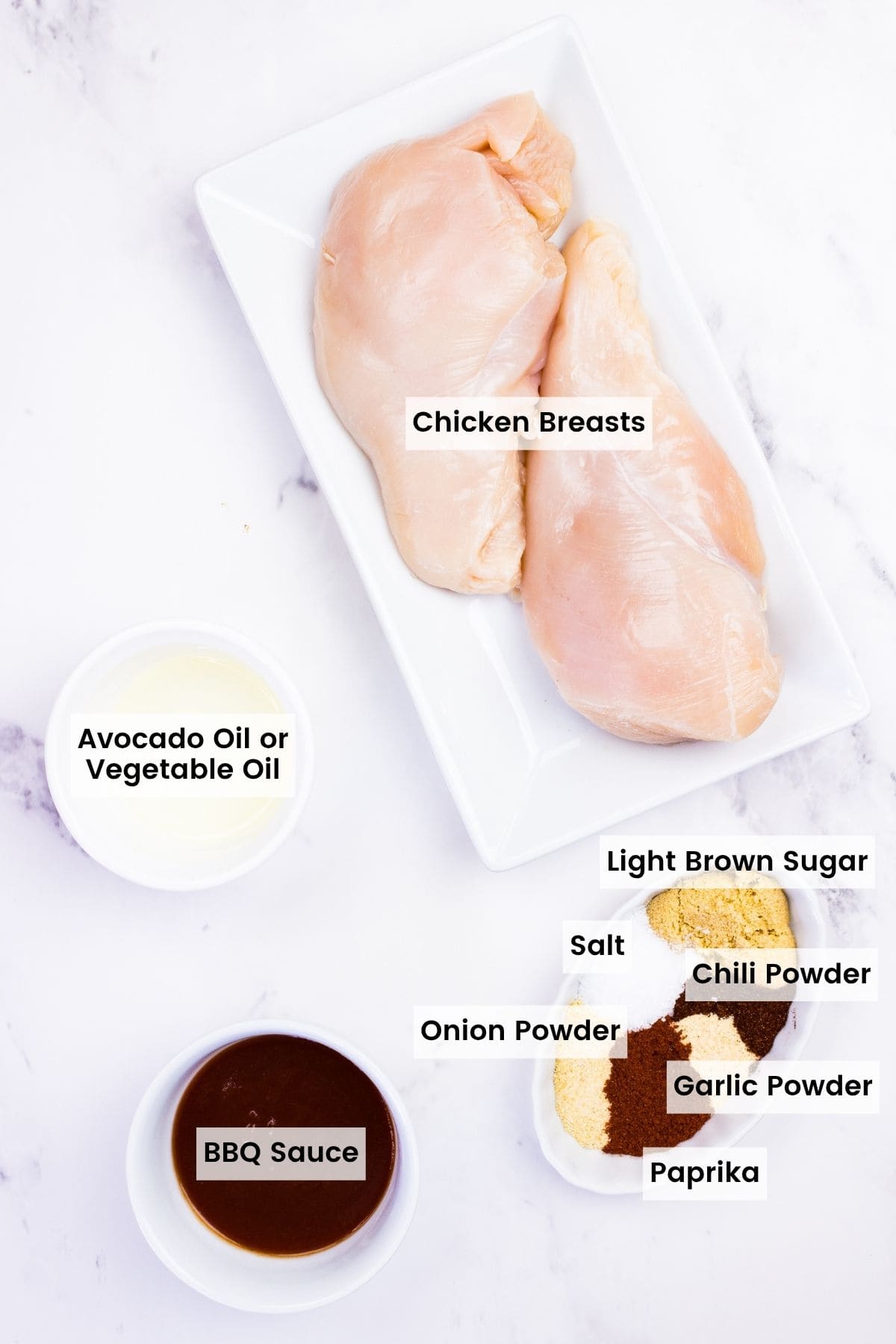 Labeled ingredients for air fryer BBQ chicken breasts.