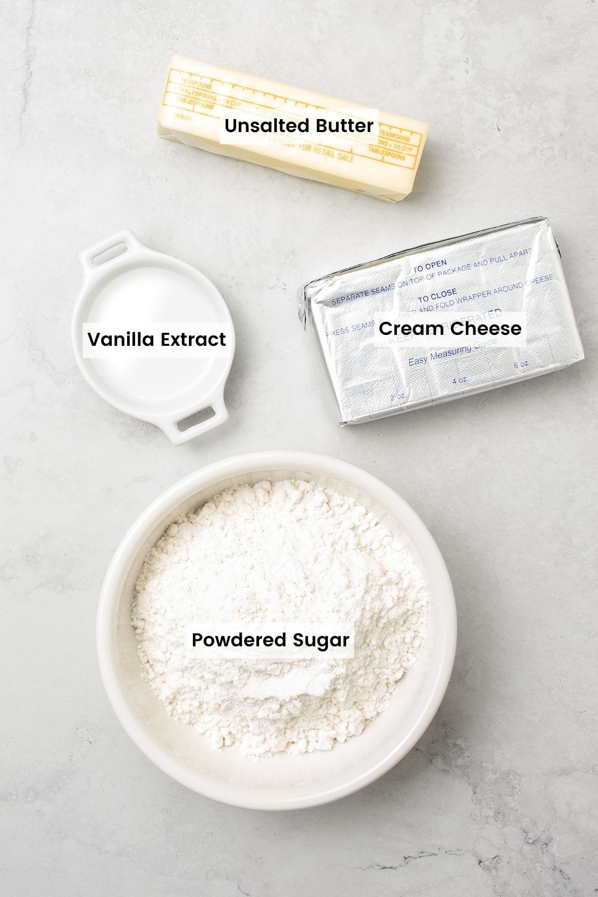 These fluffy gluten free pumpkin cupcakes with cream cheese frosting are super moist, tender, and bursting with warm pumpkin and spice! The ingredients for cream cheese frosting with text labels.