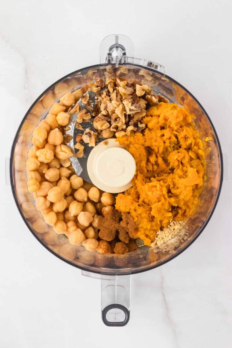 Chickpeas, sweet potato, walnuts, maple syrup, and spices in a food processor.