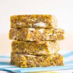 Four snack bars stacked up on napkins.