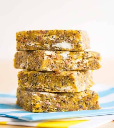 Four snack bars stacked up on napkins.