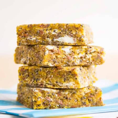 Four snack bars stacked up on napkins.