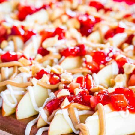Apple nachos with jammy strawberries and peanut butter drizzle.