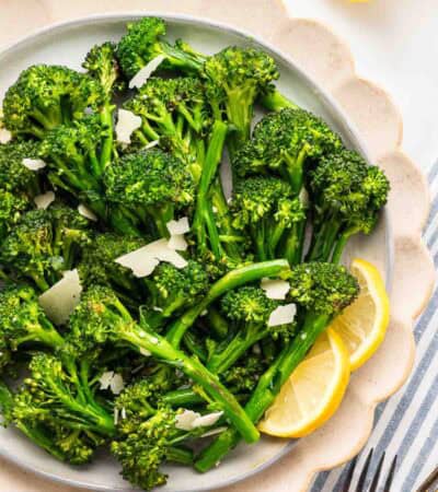 Overhead image of saut&eacute;ed broccolini on a serving platter.