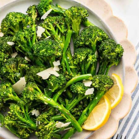 Overhead image of saut&eacute;ed broccolini on a serving platter.