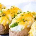 A closeup of twice-baked potatoes with text overlay that says "Broccoli Cheese Baked Potatoes".