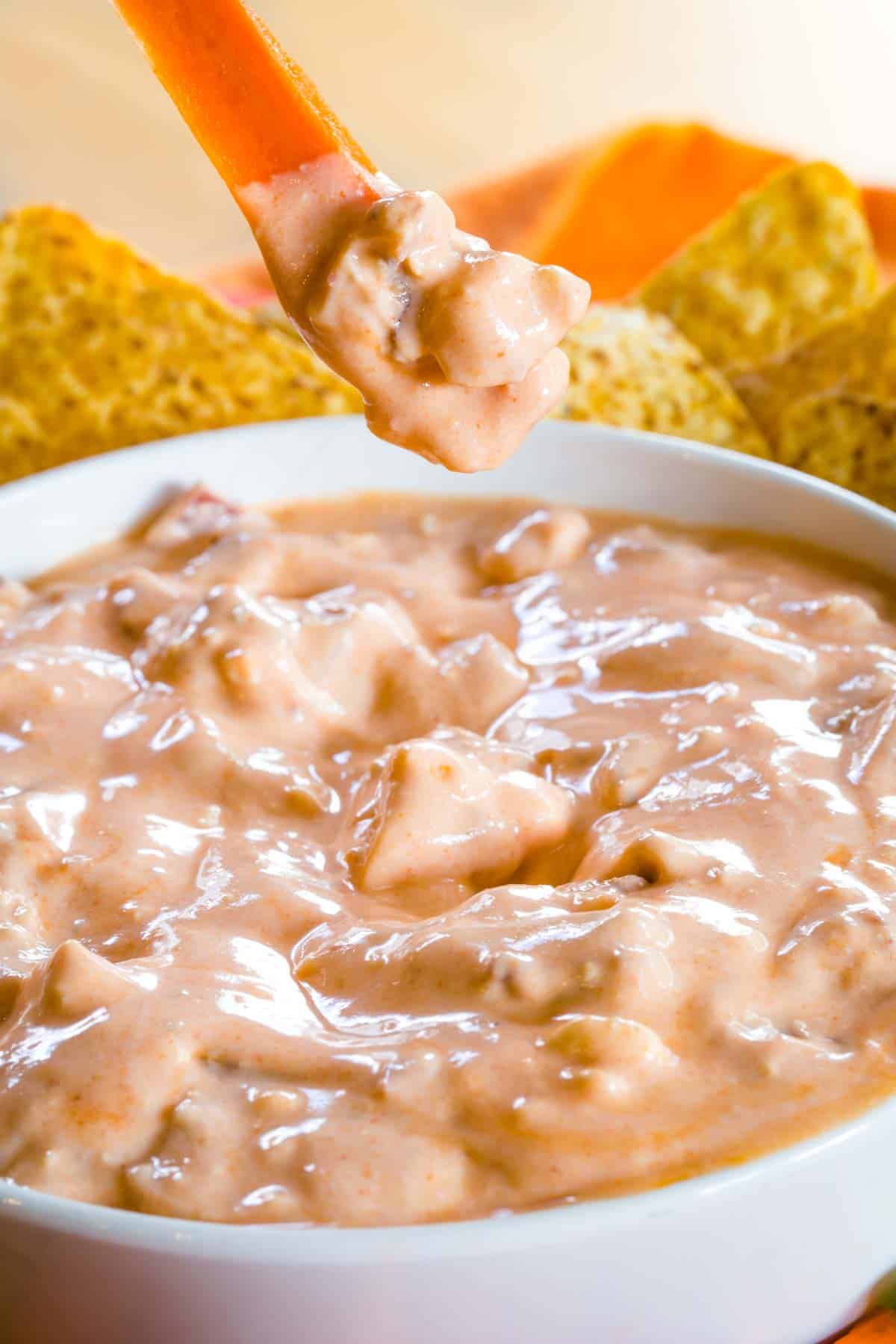 Dipping a carrot into Buffalo blue cheese dip.