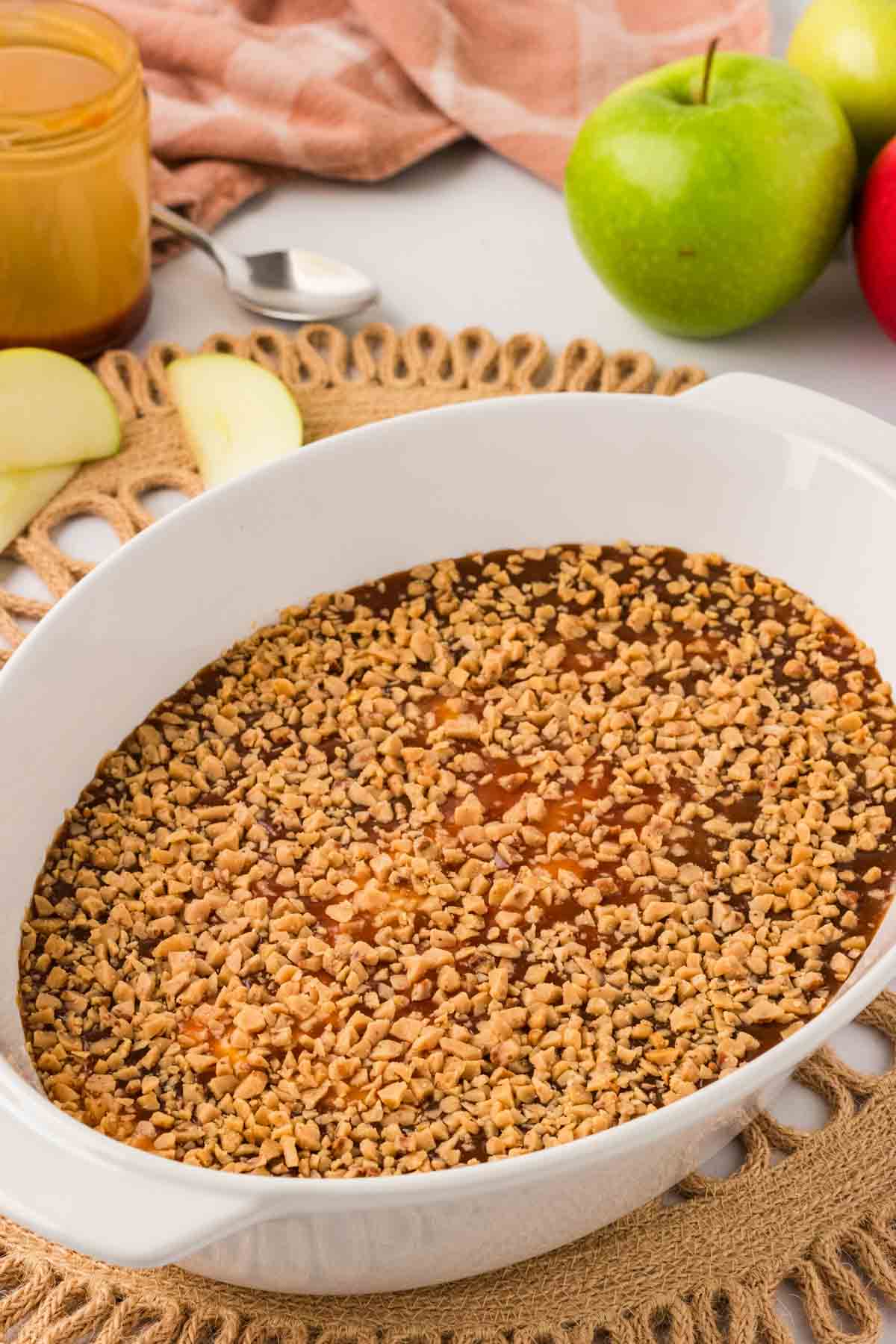 Caramel apple dip in an oval baking dish.