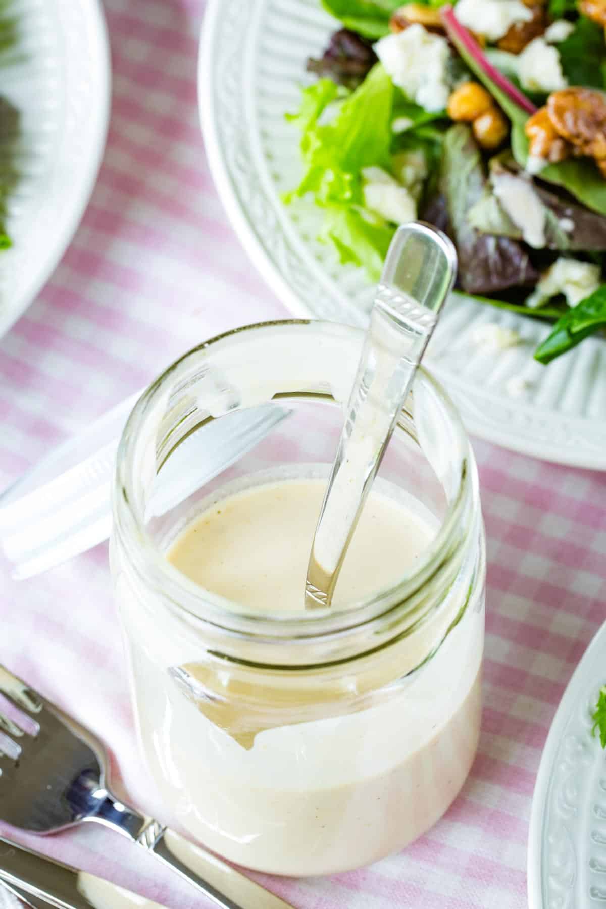 Overhead image of a jar of sherry vinaigrette in a mason jar.