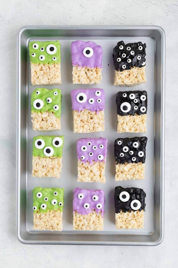 Halloween Rice Krispies treats on a baking sheet.