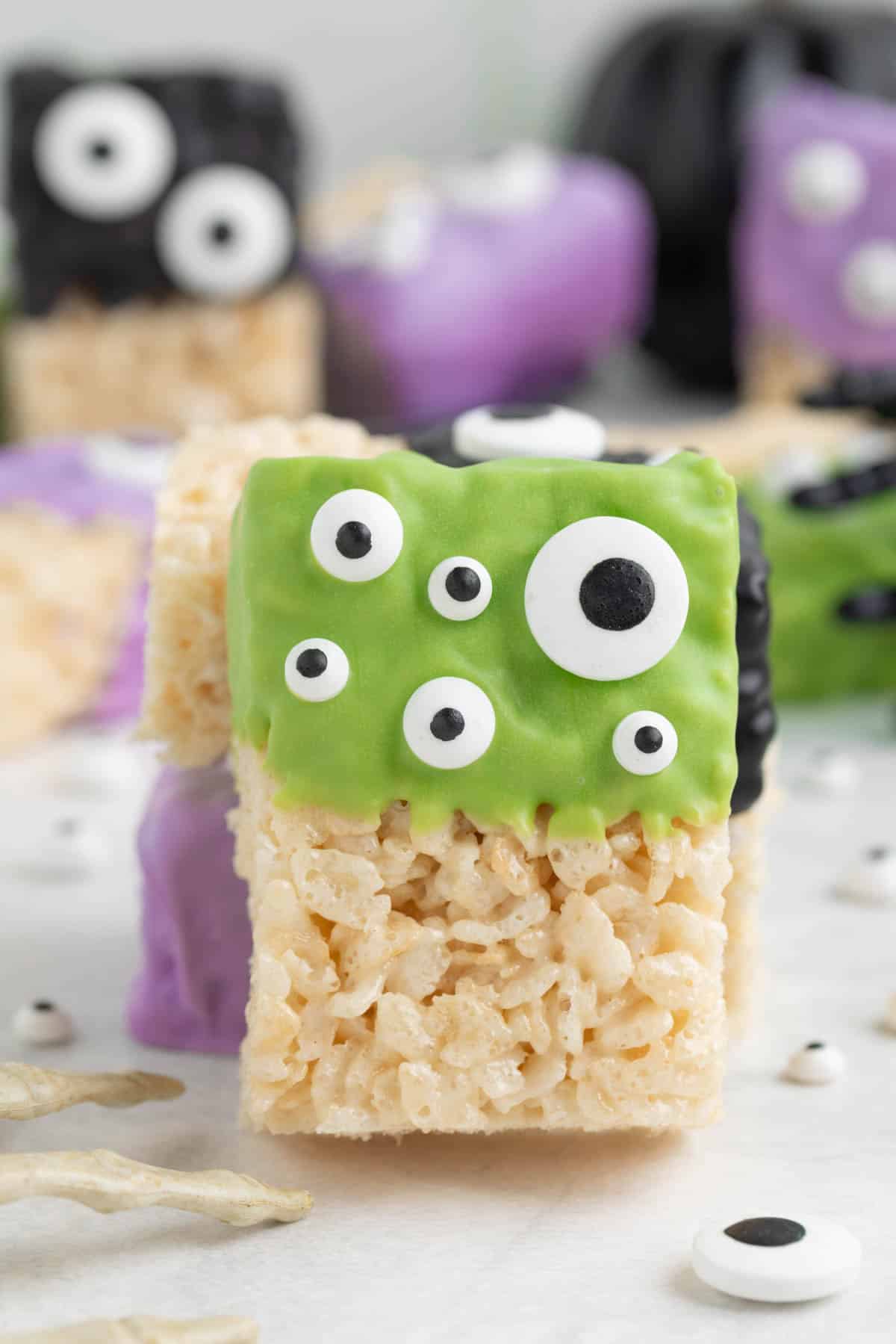Halloween Rice Krispies treats leaning up against each other.