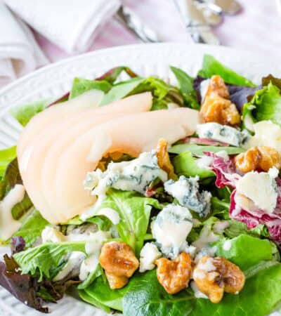 Poached pear salad with honeyed walnuts and crumbled gorgonzola.