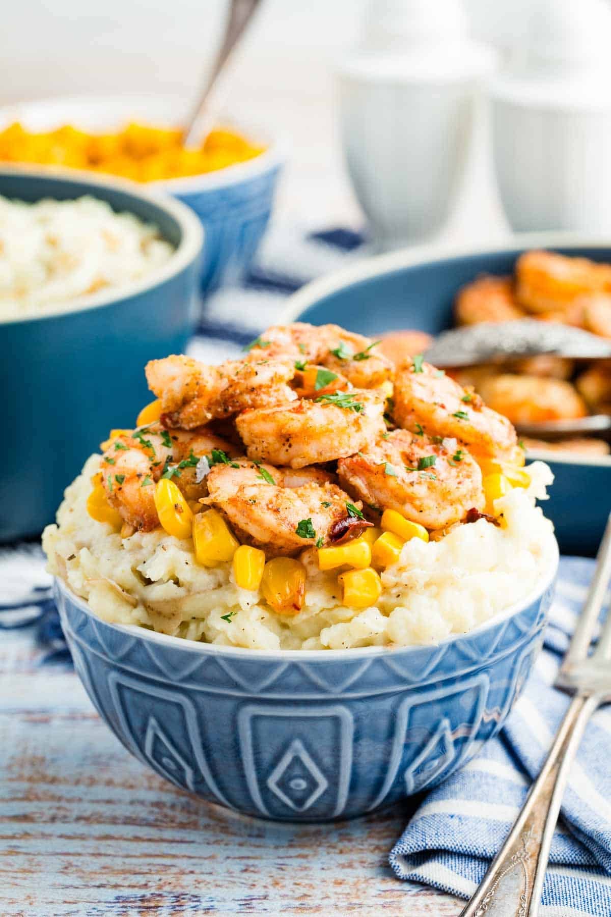 Shrimp and mashed potatoes in a bowl.