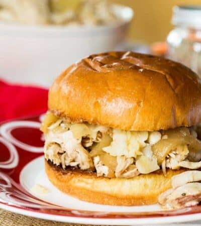 A shredded chicken sandwich on a bun.